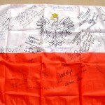 Official flag of Poland, signed by various hosts, inc. radio, magazine, & newspaper reps